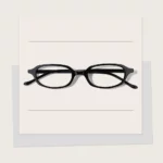 YETO-502 dark red oval eyeglasses with glossy acetate frames, rear-side view showing temple arms and hinges.
